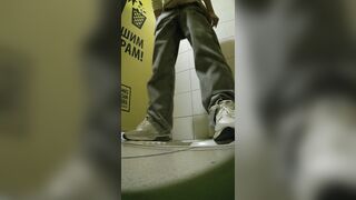 Girls peeing on the sidewalk