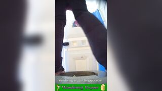 Girls peeing in a urinal