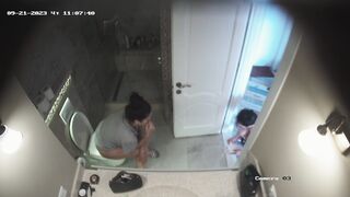 Teenage girls naked peeing on a box