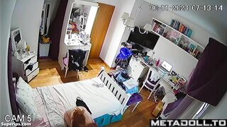 Busty redhead girl changes clothes in her room