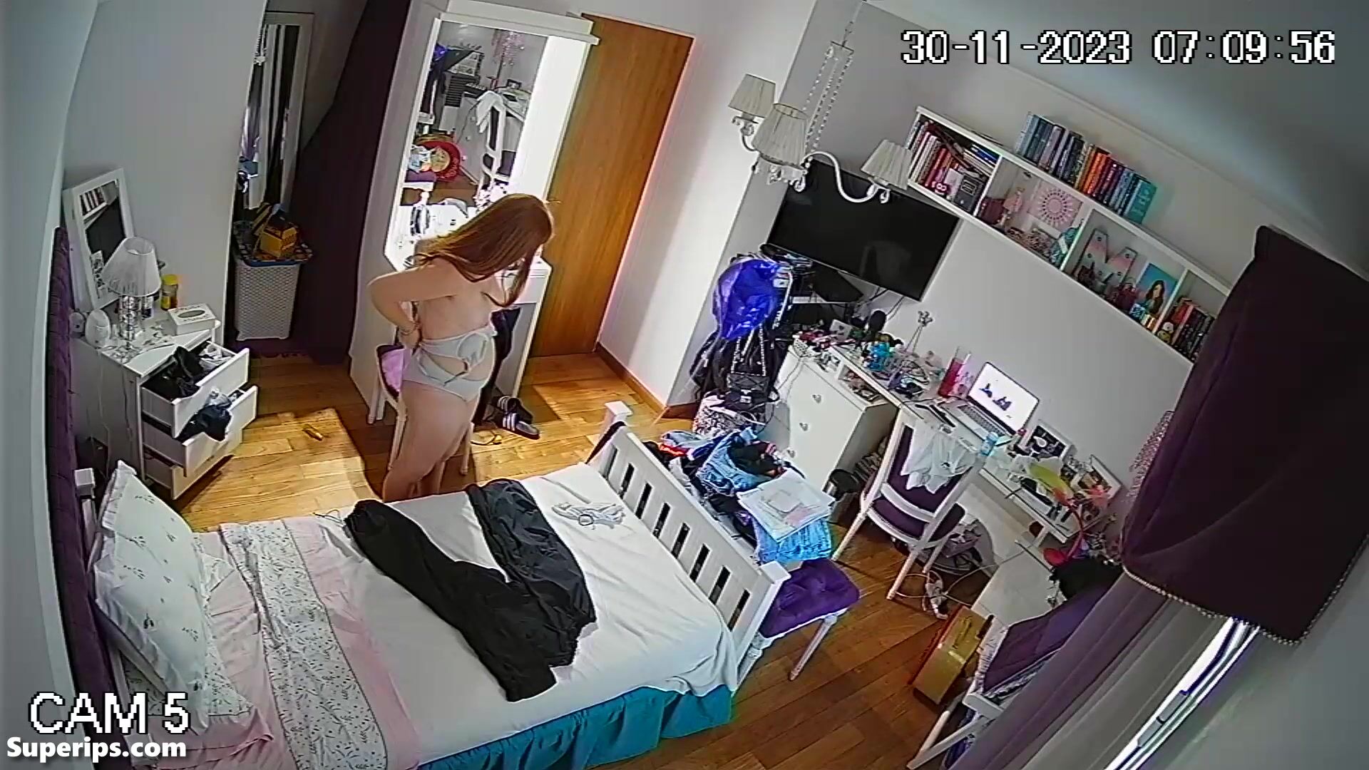 Busty redhead girl changes clothes in her room