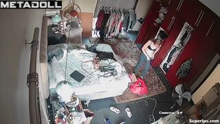 German blonde girl gets dressed in her room