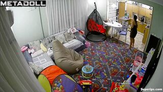 European girl gets dressed in the living room
