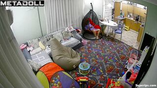 European girl gets dressed in the living room