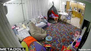 European girl gets dressed in the living room