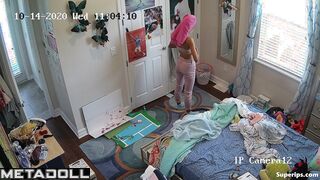 Teenage tennis girl gets dressed in her room