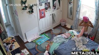 Teenage tennis girl gets dressed in her room