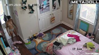 ﻿Tanned teenage girl gets dressed in her room