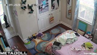 Tanned teenage girl gets dressed in her room