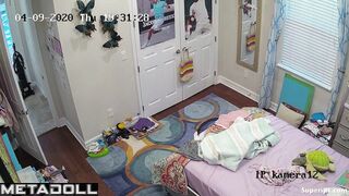 Cute skinny girl changes clothes in her room