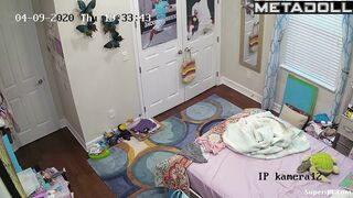 Cute skinny girl changes clothes in her room