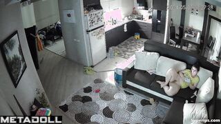 Naked mature mom watches porn on the couch