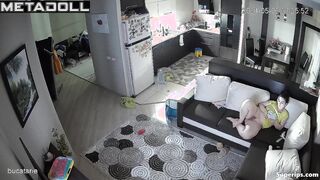 Naked mature mom watches porn on the couch