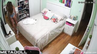 Tanned British girl is naked in her room