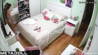Tanned British girl is naked in her room
