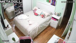 Tanned British girl is naked in her room