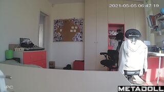 Blonde girl with glasses gets dressed in her room