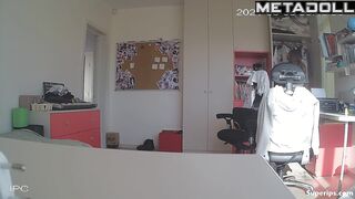 Blonde girl with glasses gets dressed in her room