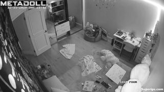 Brunette girl gets dressed in her room