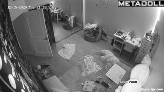 Brunette girl gets dressed in her room