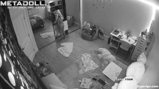 Brunette girl gets dressed in her room