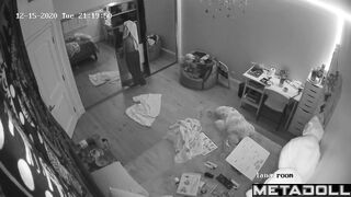 Brunette girl gets dressed in her room