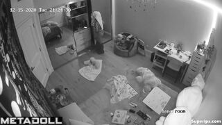Brunette girl gets dressed in her room