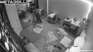 Brunette girl gets dressed in her room