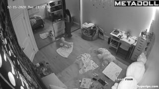 Brunette girl gets dressed in her room