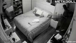 Petite European girl gets dressed in her room