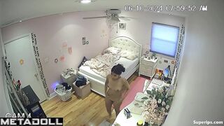 Brunette college girl gets dressed in her room