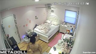 Brunette college girl gets dressed in her room