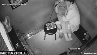 Young Korean couple kissing at karaoke