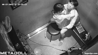 Young Korean couple kissing at karaoke