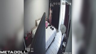 Cute blonde girl gets dressed in her room
