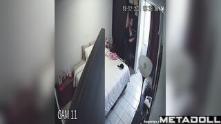 Cute blonde girl gets dressed in her room