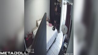 Cute blonde girl gets dressed in her room