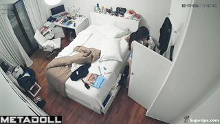 French teenage girl dresses in her room