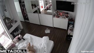 Busty blonde woman masturbates on her bed
