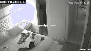 American busty woman is naked in her room