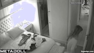 American busty woman is naked in her room