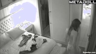 American busty woman is naked in her room