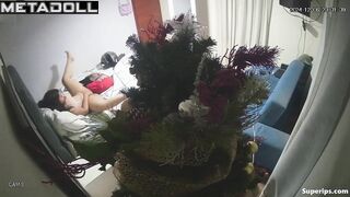 Brunette girl masturbates at Christmas