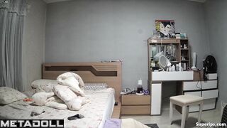 Young Korean couple in their bedroom
