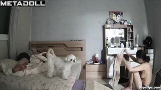 Young Korean couple in their bedroom
