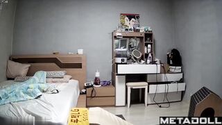 Young Korean couple in their bedroom