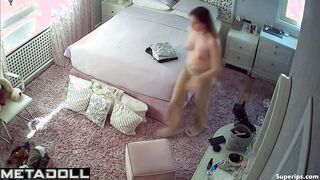 Beautiful busty girl naked in her bedroom