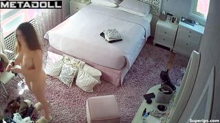 Beautiful busty girl naked in her bedroom