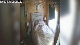 Chubby couple lying under the blanket, hidden video
