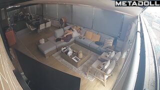 Couple hugging warmly while lying on a sofa, watch